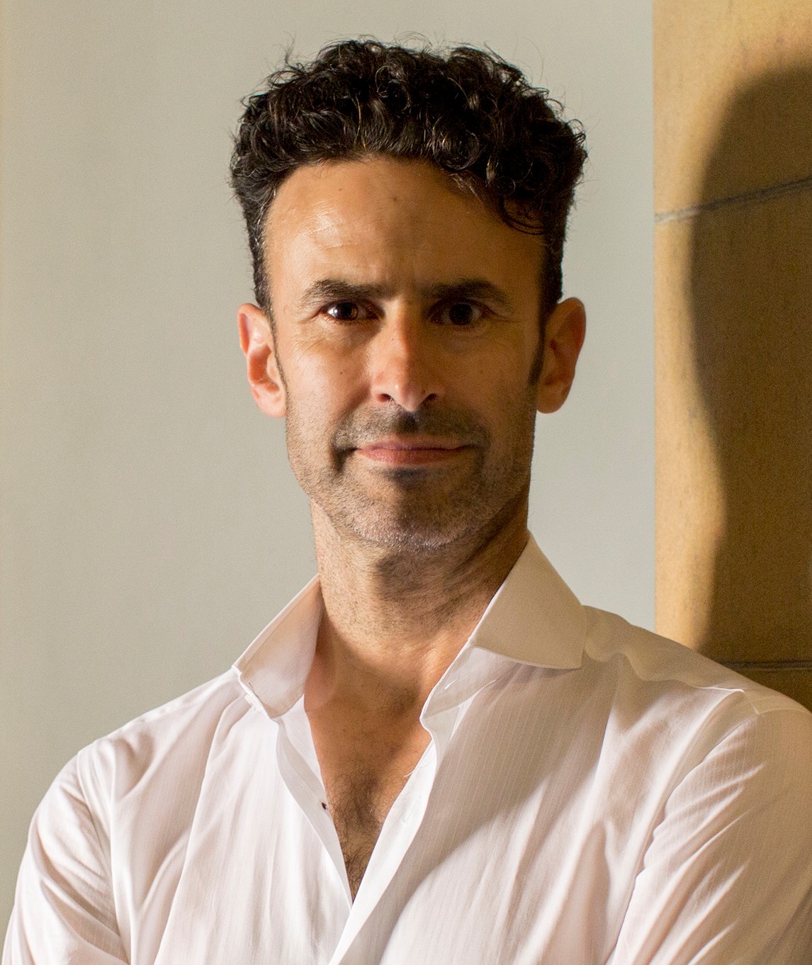 Conductor and choral director Tobias Cole pictured wearing a white shirt