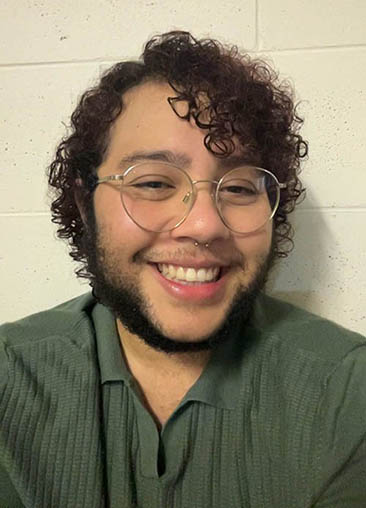 Elliot Passi in a green polo shirt