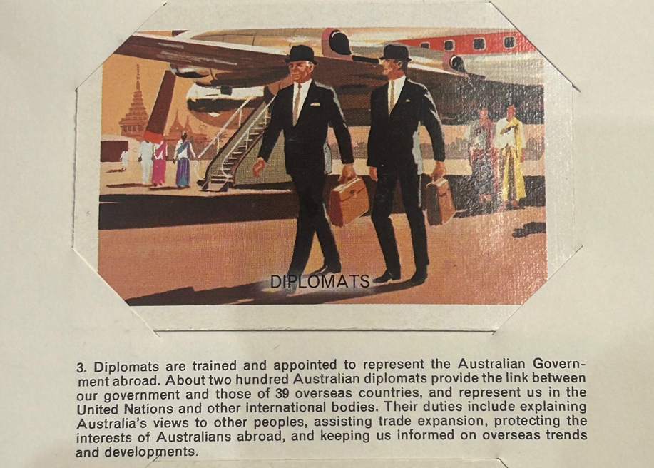 Picture of two men in suits and hats walking down a shopping street