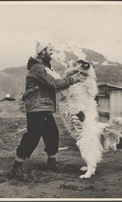An explorer with George the huskie, Antarctica, 1955