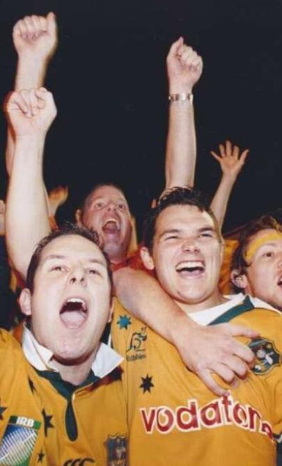 Three friends watch Rugby World Cup 2003 from the Rocks