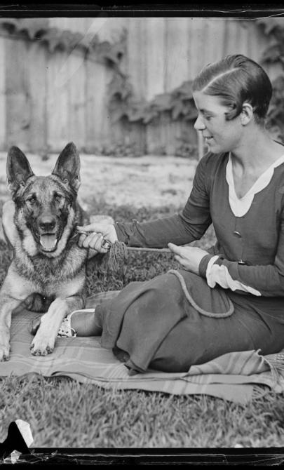 Swimmer Bonnie Mealing with a German Shepherd dog, New South Wales, ca. 1930s.jpg