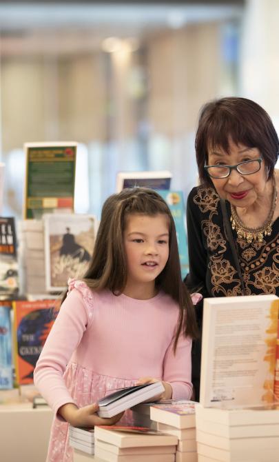 Young girl and older woman browsing at the Bookshop