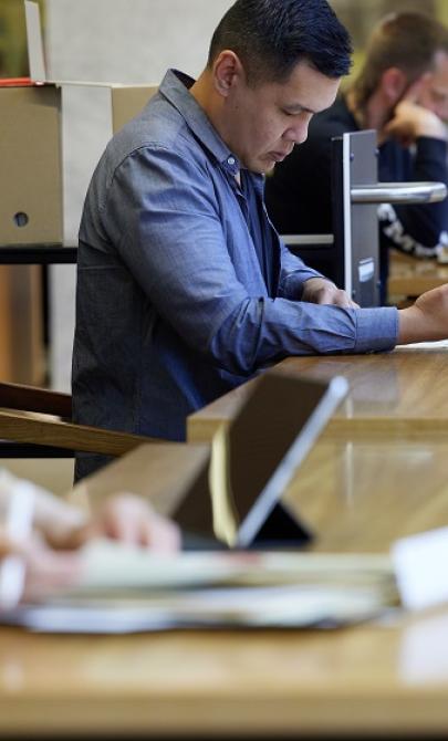 Three research fellows working in the Special Collections Reading Room.