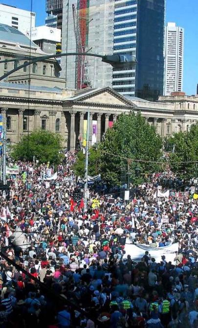 A photo of a large number of protestors gathered in front of the Victorian state library.