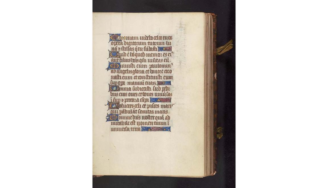 A handwritten page from an old book. It is highly decorated and colourful. 