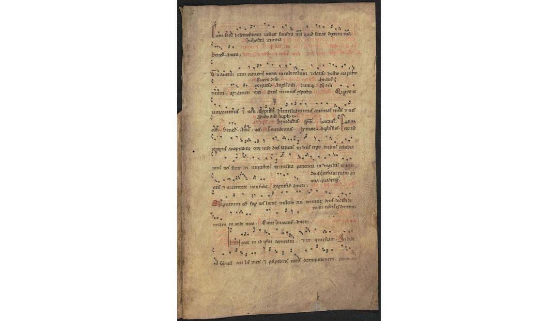 Detail view of a handwritten musical score. The lyrics are in Latin. The musical notation looks similar to modern forms with a treble and bass line clearly visible.
