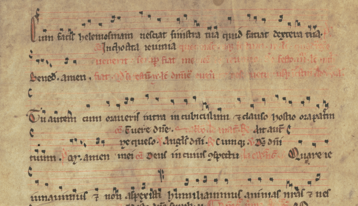 Detail view of a handwritten musical score. The lyrics are in Latin. The musical notation looks similar to modern forms with a treble and bass line clearly visible.
