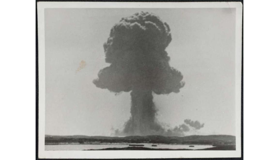 black and white photograph of the mushroom cloud from a nuclear blast