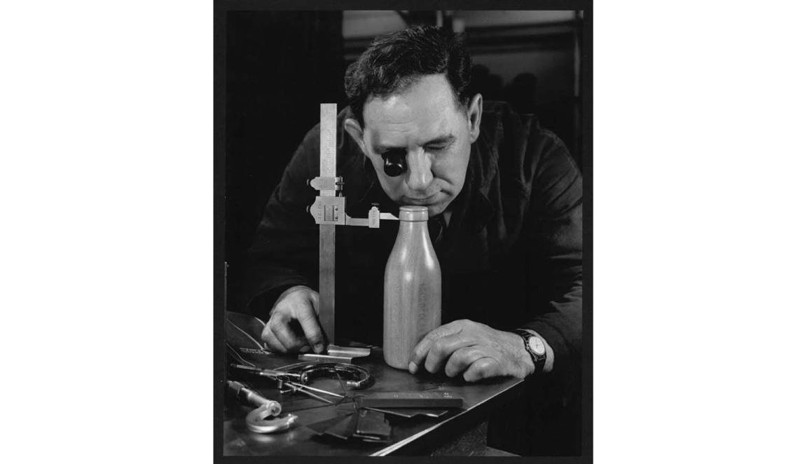 Man inspecting milk bottle pattern