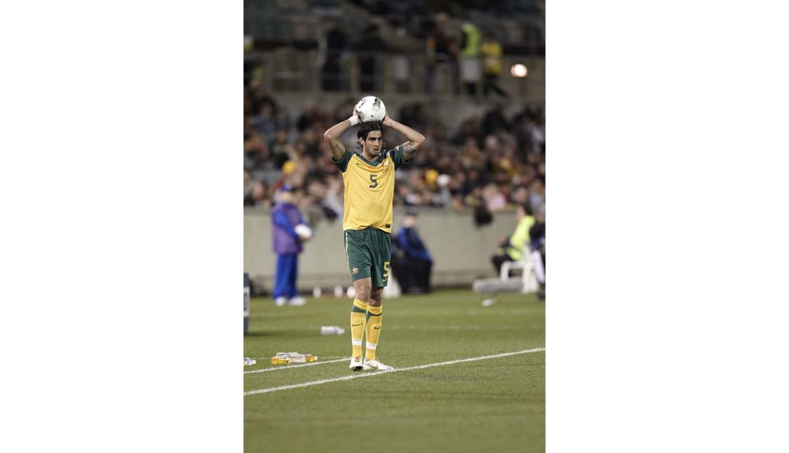 Photo of Socceroo, Rhys Williams throwing a soccer ball over head