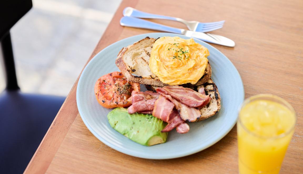 Scrambled eggs, avocado, tomato and bacon