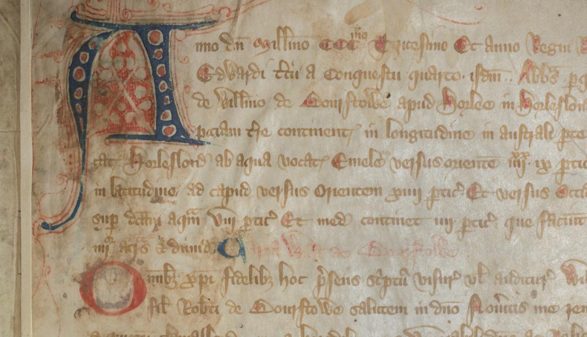 Close up of page of old, rare Latin book with a stylised letter A in the top left