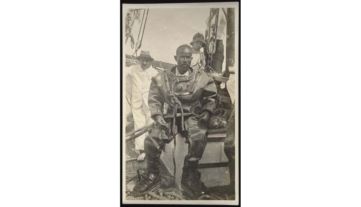 photo of a man in pearl diving gear