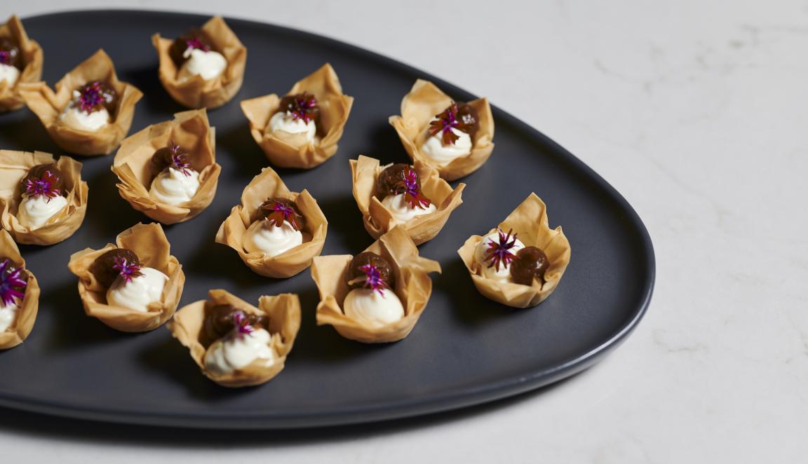 Catering plate set up with tasty pastry bites
