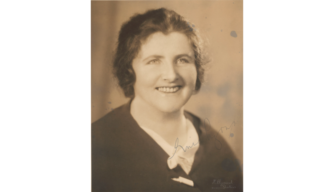 Sepia-toned photographic portrait of Dame Enid Lyons smiling