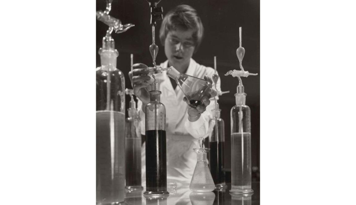 A woman with chemistry equipment 