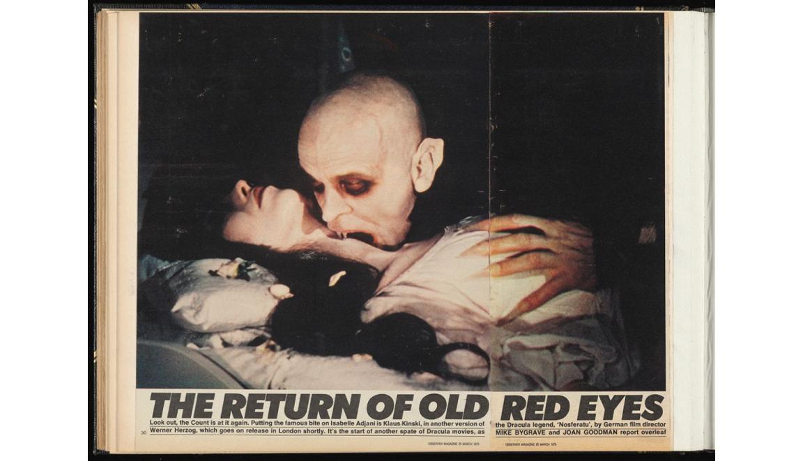 newspaper clipping with image of vampire biting a woman's neck, titled: The return of old red eyes