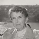 Portrait of Isobel Bennet with the beach behind her