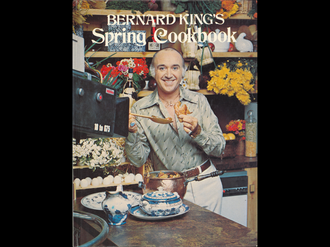 Cover of cookbook with a photo of Baernard King standing in a kitchen smiling over a pot