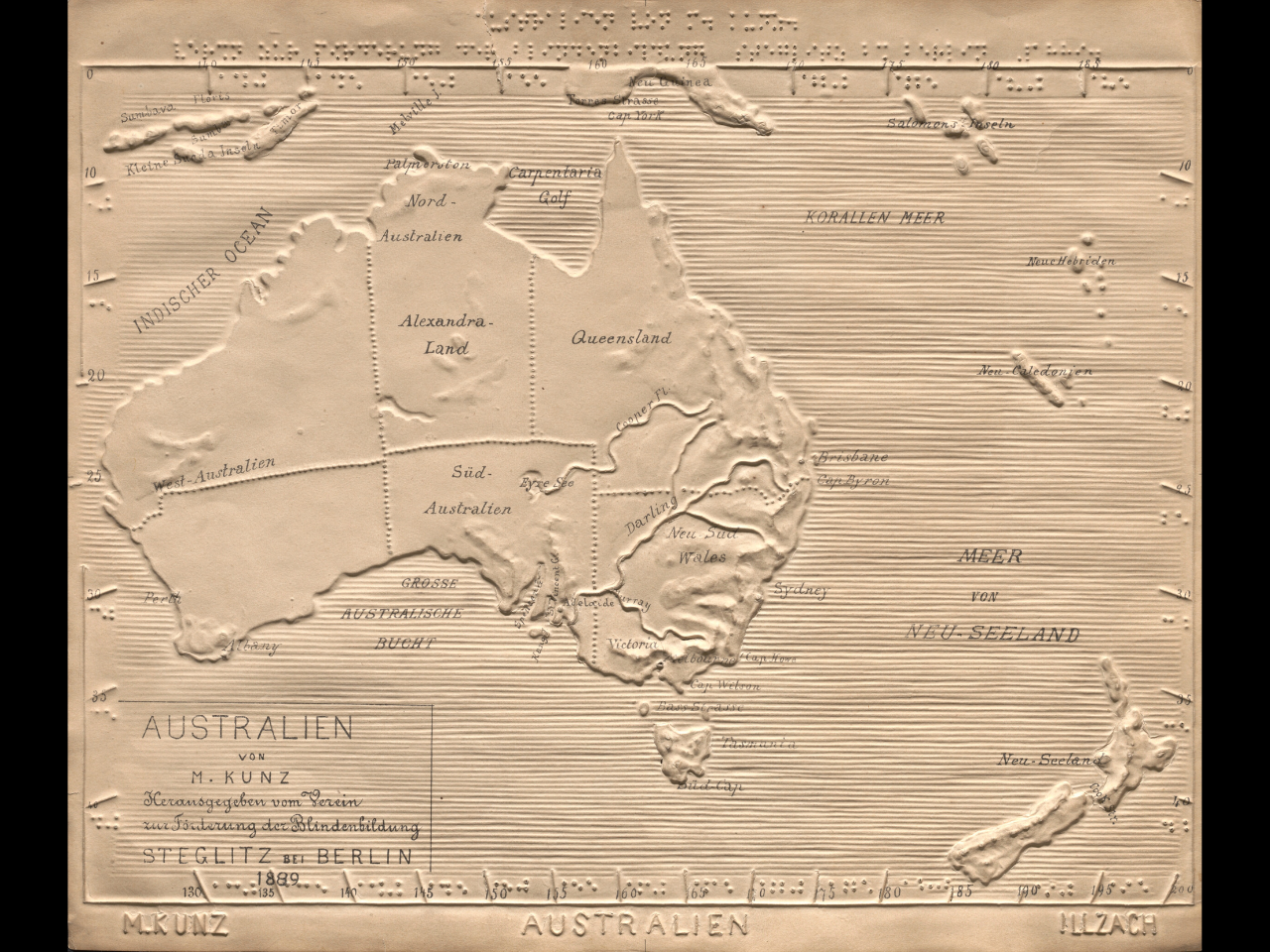 A map of Australia and New Zealand with braille script and other tactile features visible
