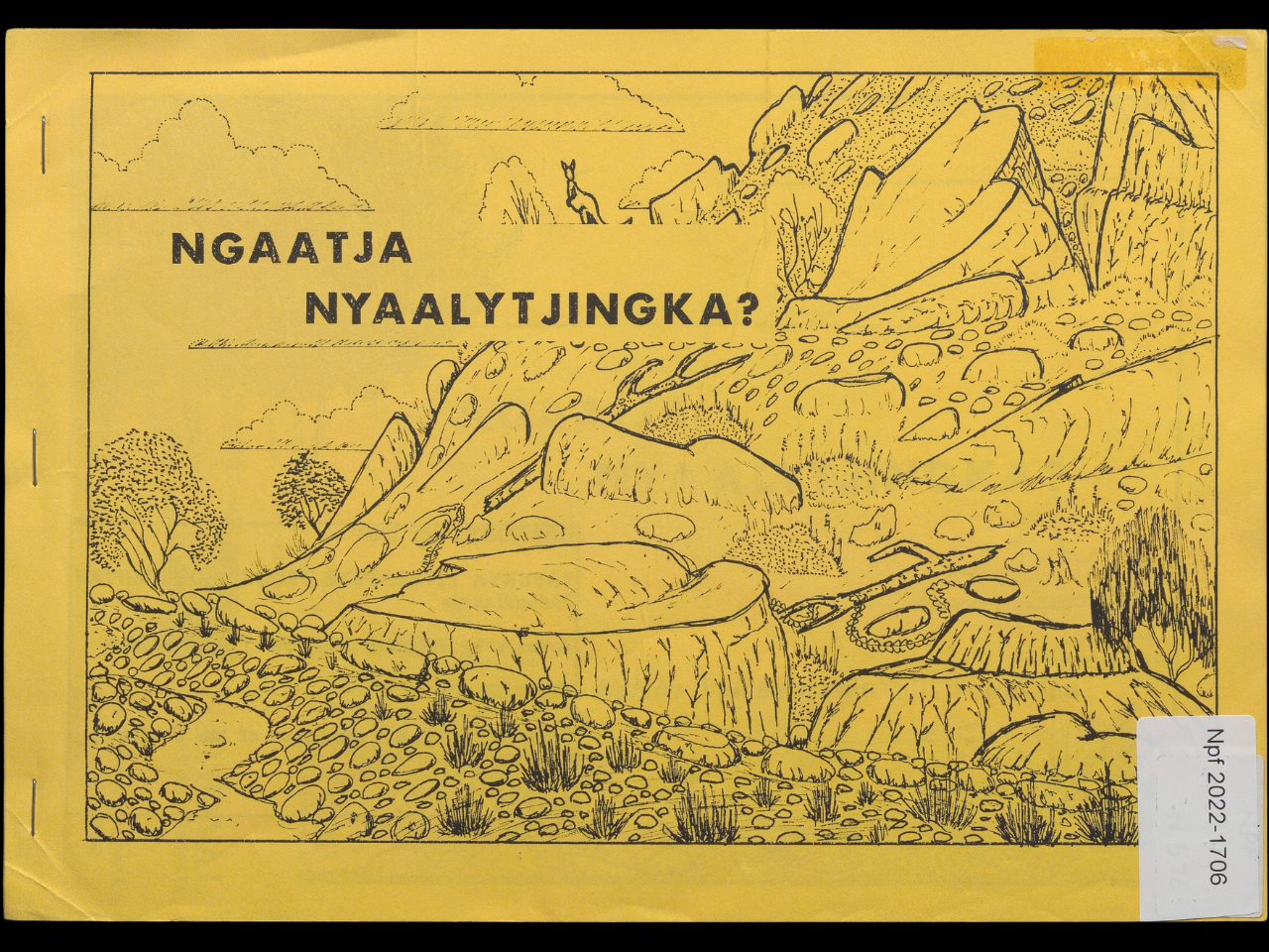 The cover of a book featuring an illustration of a kangaroo on a rocky hillside. 