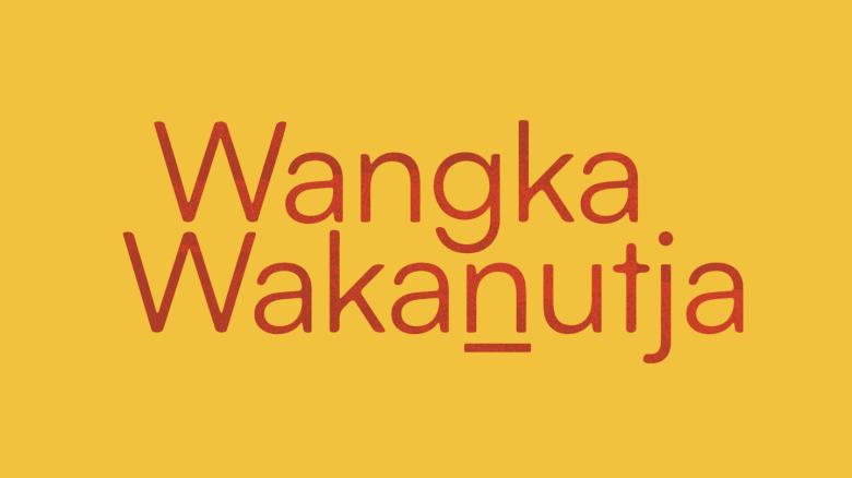 Red text reading 'Wangka Wakanutja' on a yellow background
