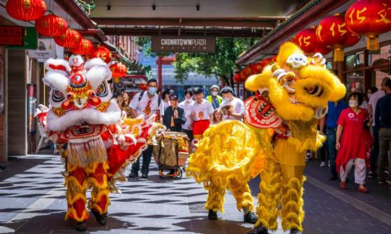 People watch lion dances in Chinatown Plaza in Adelaide