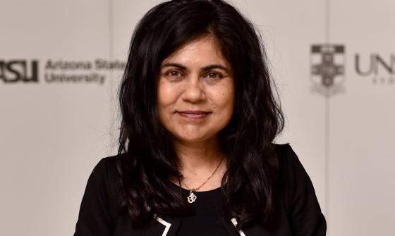 A photo of a smiling woman dressed in black