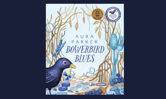Book cover with blue bird with a blue flower in it's beak, standing near other blue objects, including a fork, spoon, bottle lids and more