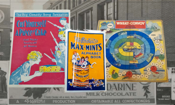 Three colourful advertisements, including a board game, photoshopped on a black and white background