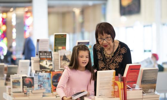 Young girl and older woman browsing at the Bookshop