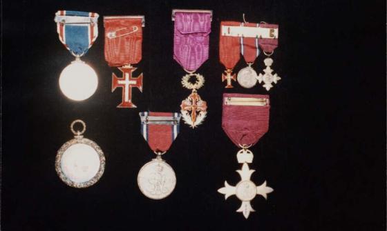 Nine medals awarded to J.P. and J.M. Braga, including an OBE awarded to J.P. Braga