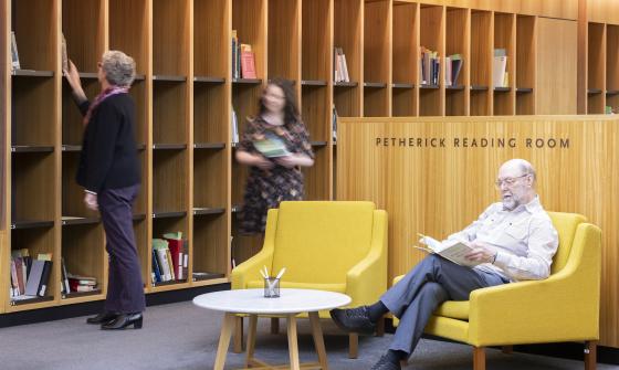People sitting, reading and browsing material in the Petherick Reading Room