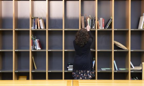 Woman pulling material from a cubby in the Specials Collections Reading Room