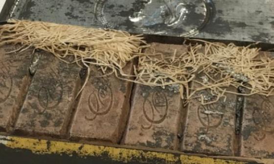 Old box of chocolates in an aged metal tin 
