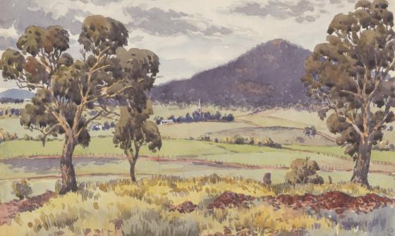 Landscape watercolour showing trees, hilly, grass covered terrain, few small buildings and a mountain in the distance