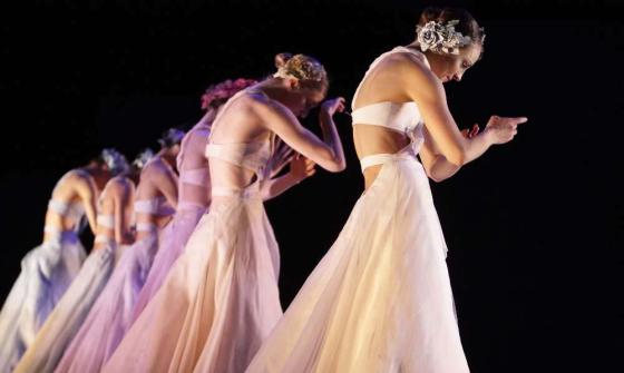 Six women ballet dancers standing in a line
