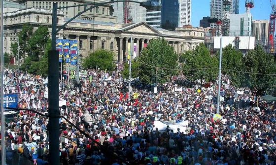 A photo of a large number of protestors gathered in front of the Victorian state library.