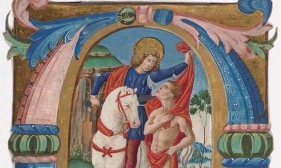 A large very ornate illuminated letter 'O'. The letter is drawn in gold (the original is guilded and shiny, the digital copy is matt). Surrounding the letter are columns of blue and pink. Leaves and fronds decorate the top and bottom. Within the middle of the "O" is a figure in a blue and red robe riding a white horse. He has a halo on his head. He is leaning off of his horse to drape his red cloak over a naked man walking alongside his horse. The men are looking at each other.