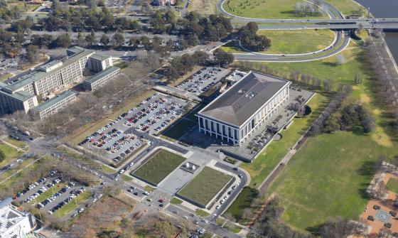 View of the Library building, carparks and nearby buildings and roads seen from a drone