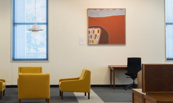 Orange, brown and white painting hung in the main reading room