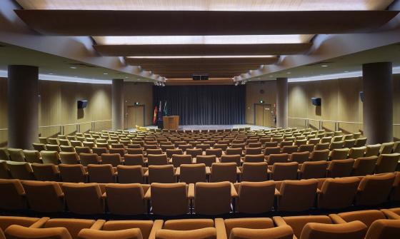 Looking from the back of an empty theatre towards the stage