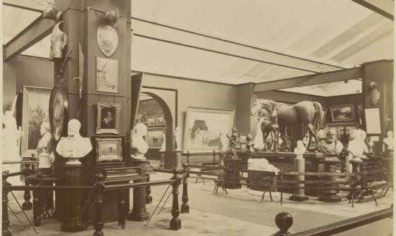 sepia photo of a room with lots of old objects