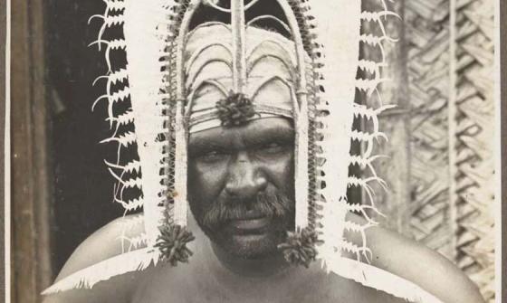 photo of a man wearing an islander head dress
