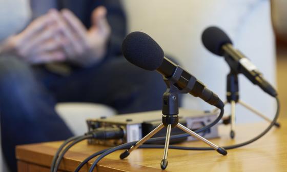Two microphone on a table during an oral history interview