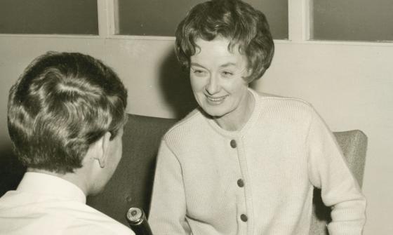 Sepia-toned photo of oral historian Hazel de Berg smiling while interviewing Michael Terry