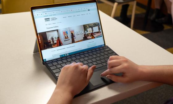 Laptop open to the Treasures Gallery exhibition page of the National Library website