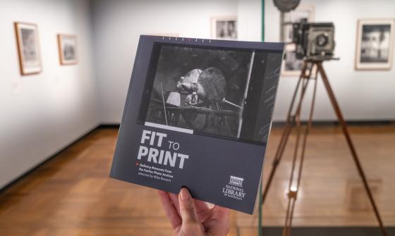 Fit to Print exhibition book being held in the exhibition gallery