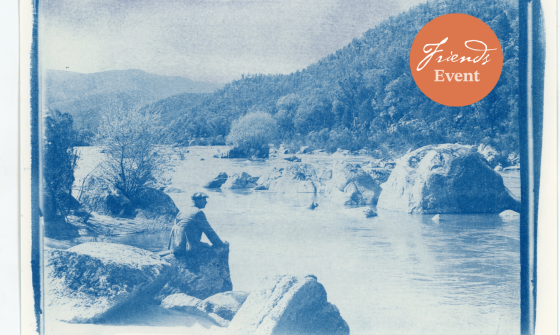 Blue and white cyanotype printed photo of a man sitting on a rock by a river. Photoshopped in on the top right is an organe circle reading 'Friends event'